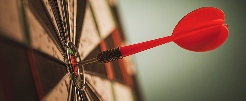 Vender mais imóveis: dardo fincado no meio de um alvo