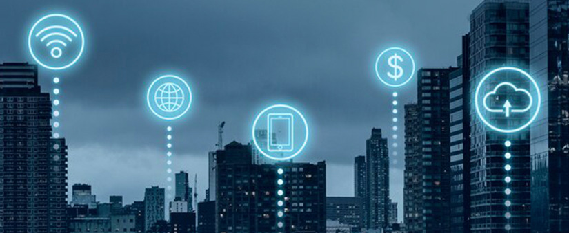 transformação digital Imagem de uma cidade com alguns prédio e ilustrações de ícones que representam conectividade