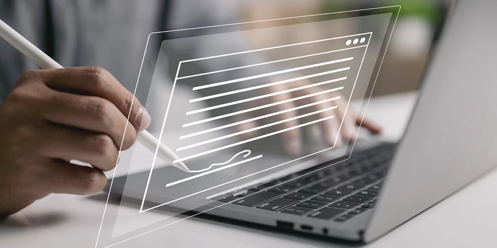 Como saber se o habite-se foi aprovado Como saber se o habite-se foi aprovado : close nas mãos de uma pessoa em frente a um notebook. Em frente ao notebook uma ilustração de página de site.