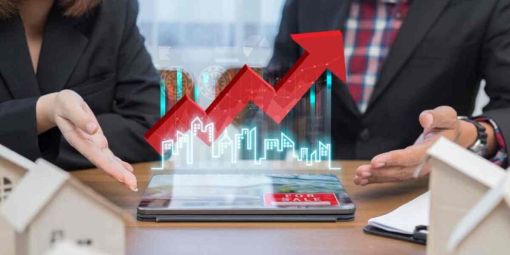 Indicadores imobiliários Indicadores imobiliários: imagem das mãos de duas pessoas apontando para um gráfico no meio da tela.