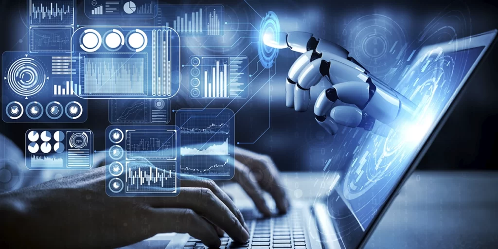 O que é um assistente virtual O que é um assistente virtual: imagem de um tablet com algumas luzes azuis e a mão de um robô saindo da tela.