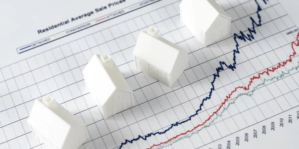 PropCo PropCo: imagem vista de cima de um gráfico e algumas miniaturas de casa em cima.