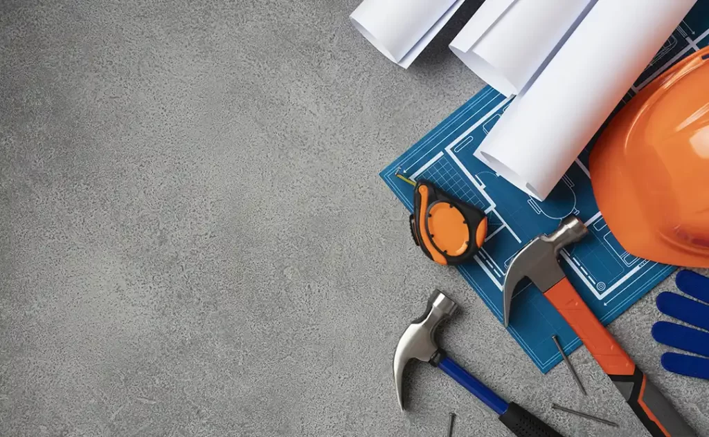 NBR 15575 NBR 15575: imagem vista de cima de uma superfície plana com alguns elementos de construção civil no canto da tela.