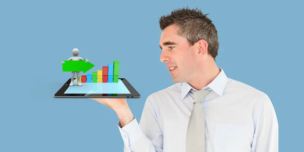 leads de loteadoras leads de loteadoras: imagem de um homem segurando um tablet. Da tela do tablet salta um gráfico de barras colorido e um boneco segurando uma seta.